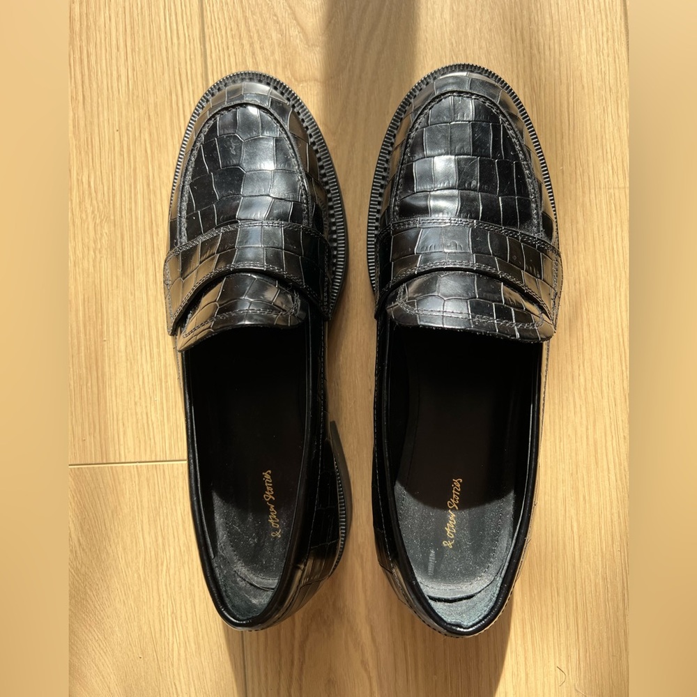 Classic penny-style loafers a polished leather. Brand: &other stories . Size 8